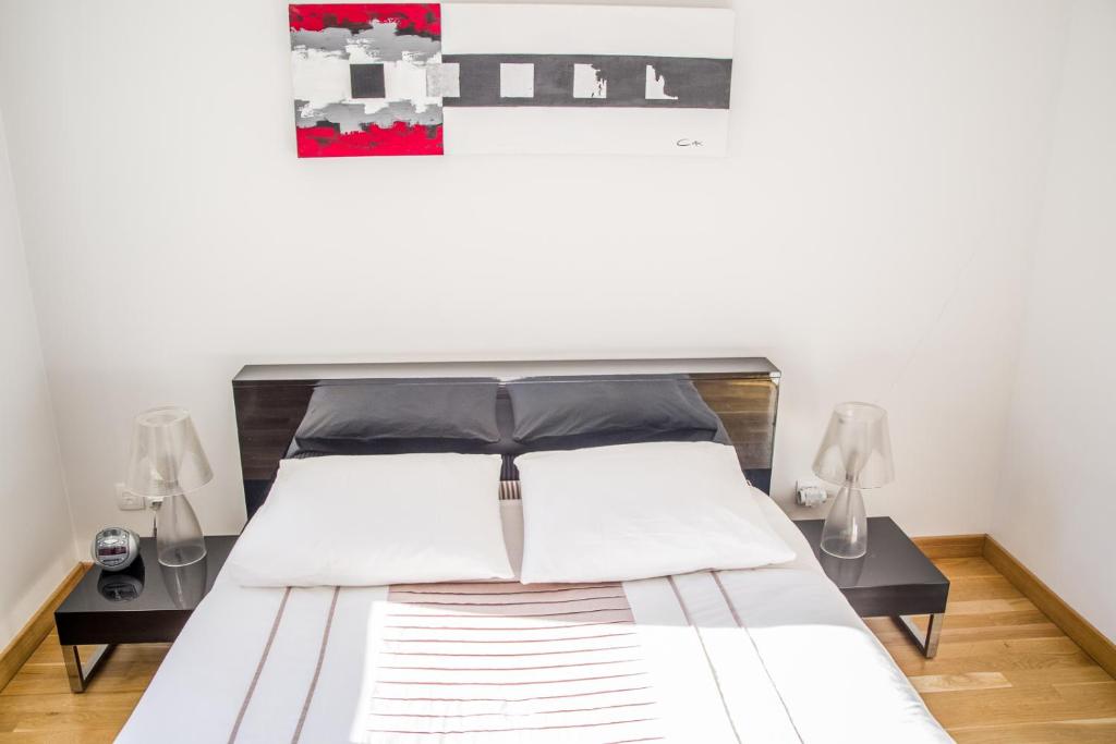 Postel nebo postele na pokoji v ubytování Appart'cosy Lyon Est