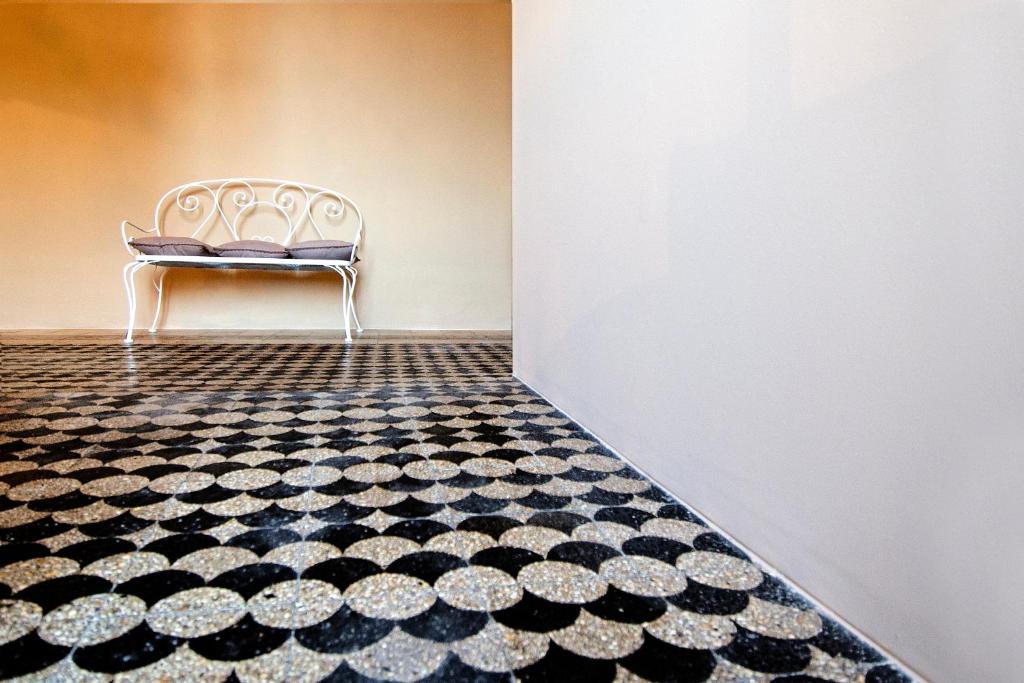 Łóżko lub łóżka w pokoju w obiekcie BluLassù City Center Rooms