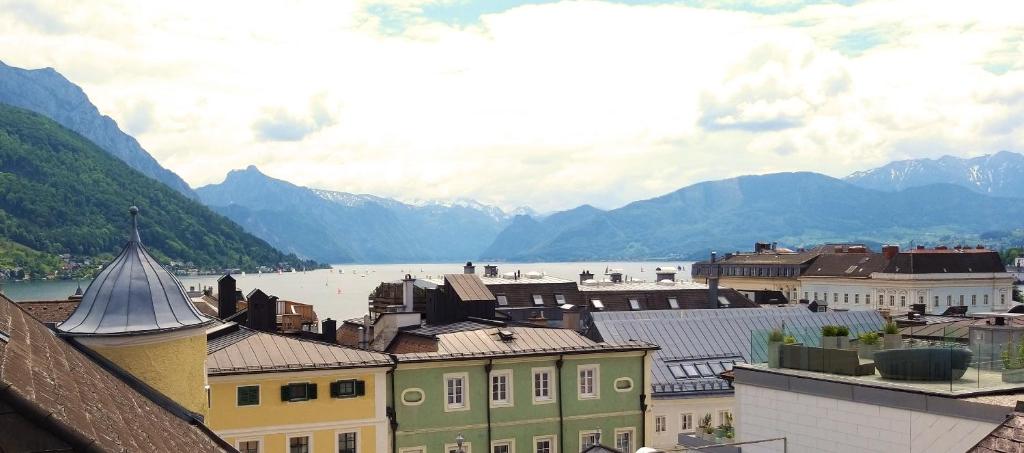 a view of a town with a lake and mountains at Apartment on Johannes-Gasse in Gmunden