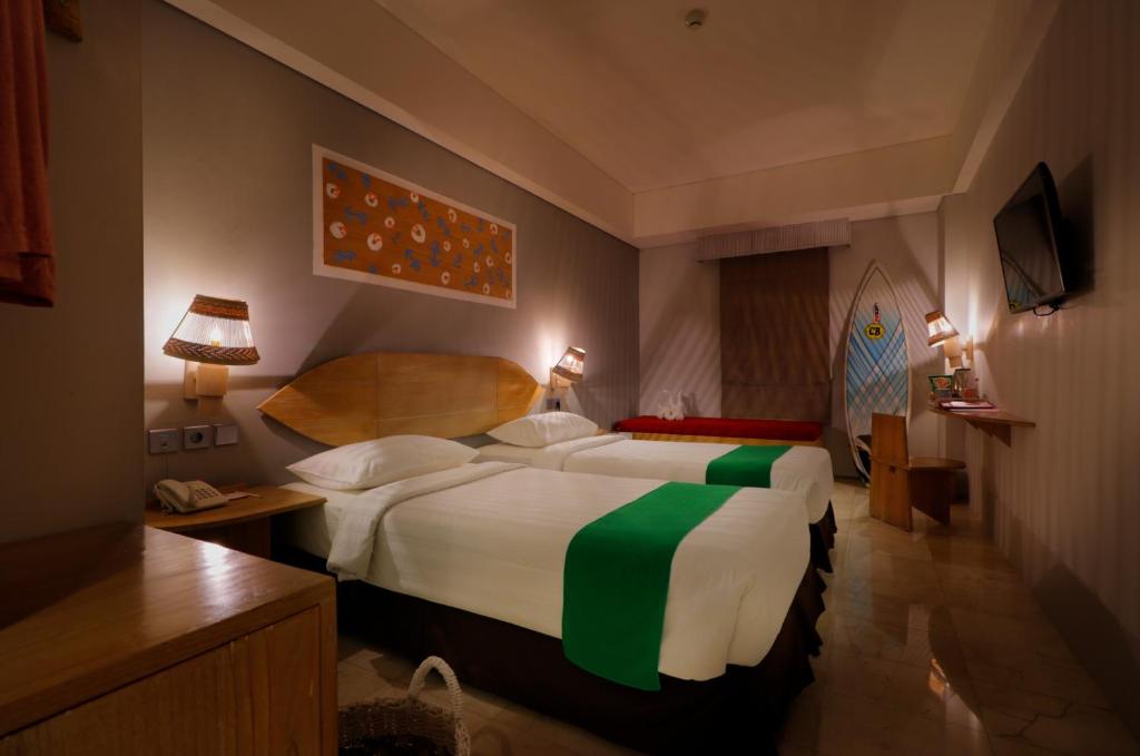 Postel nebo postele na pokoji v ubytování Koa D Surfer Hotel