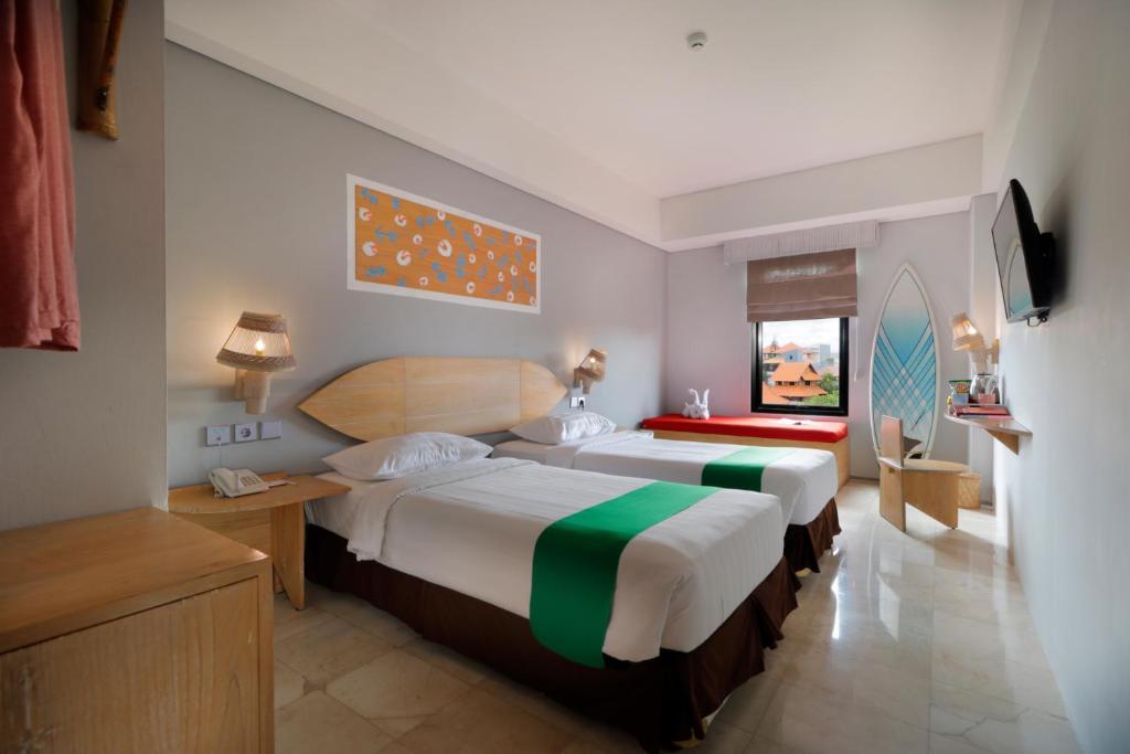 Postel nebo postele na pokoji v ubytování Koa D Surfer Hotel