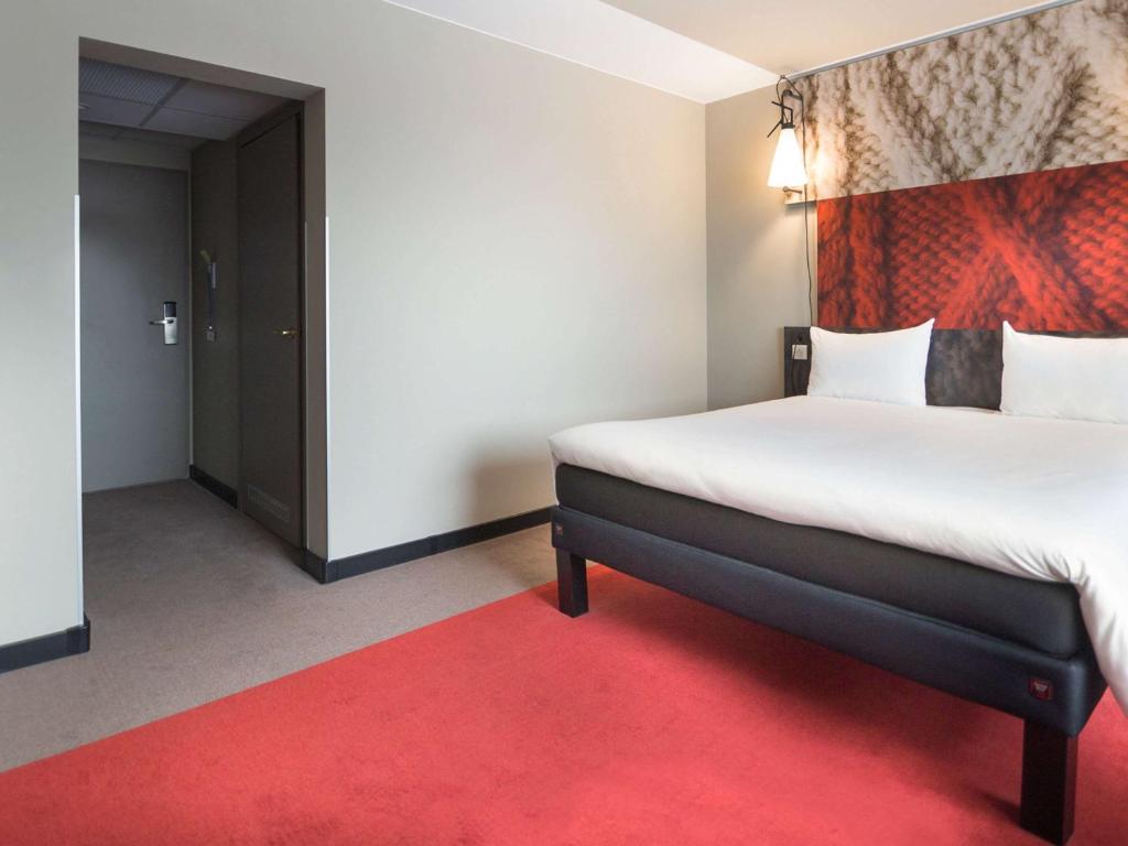 Postel nebo postele na pokoji v ubytování Ibis Poznan Centrum