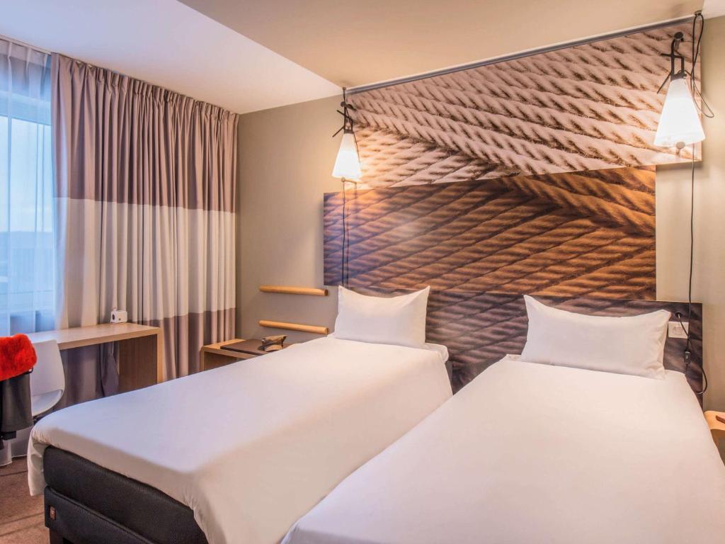 Postel nebo postele na pokoji v ubytování Ibis Poznan Centrum