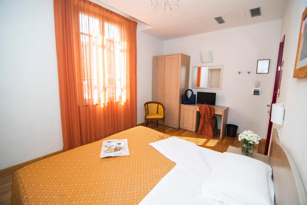 Postel nebo postele na pokoji v ubytování Hotel La Colonna