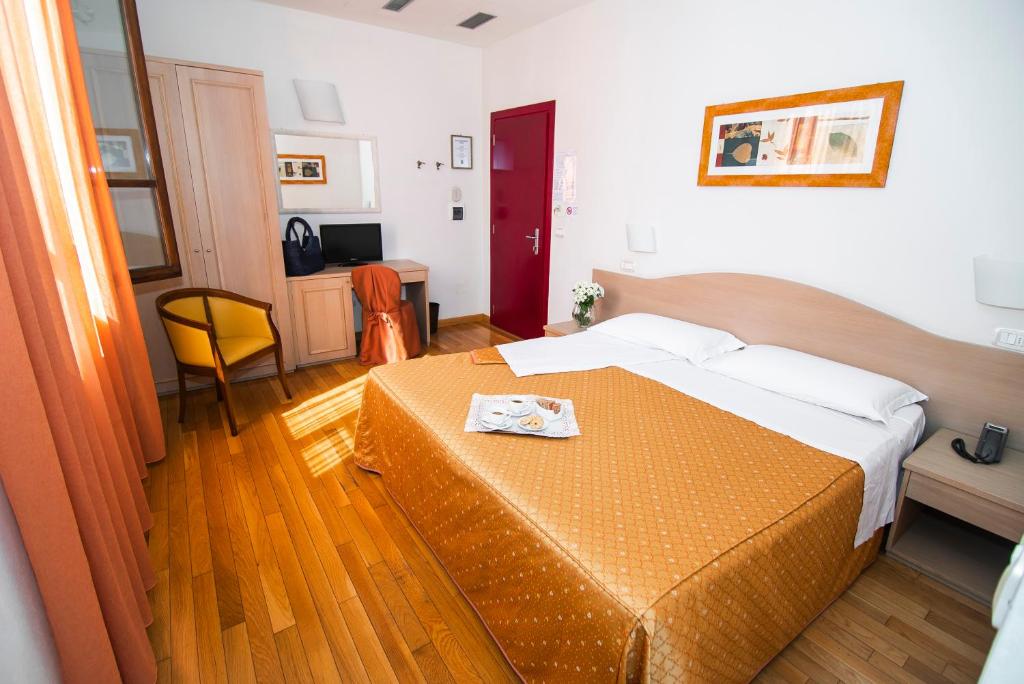 Postel nebo postele na pokoji v ubytování Hotel La Colonna