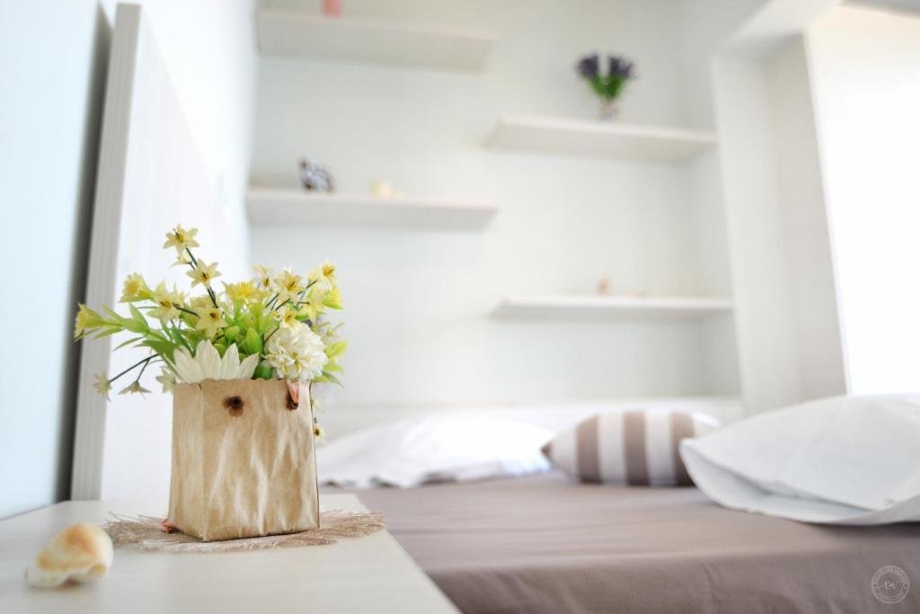 Postel nebo postele na pokoji v ubytování MOUSELIS APARTMENTS