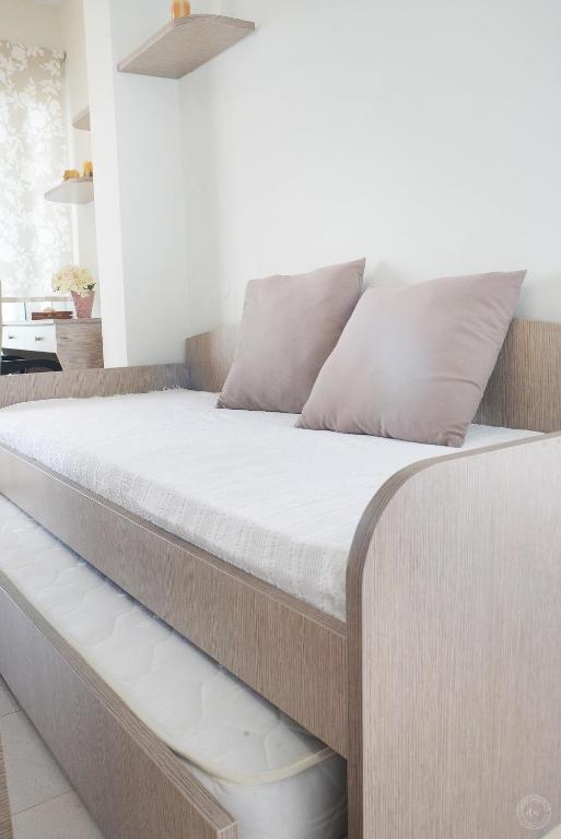 Postel nebo postele na pokoji v ubytování MOUSELIS APARTMENTS