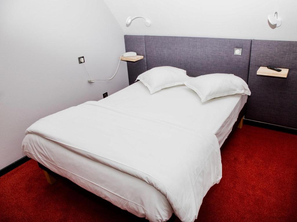 Postel nebo postele na pokoji v ubytování Hôtel Le Verger De Bischwiller