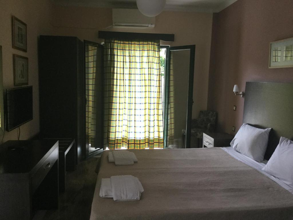 A bed or beds in a room at Villa Vasso