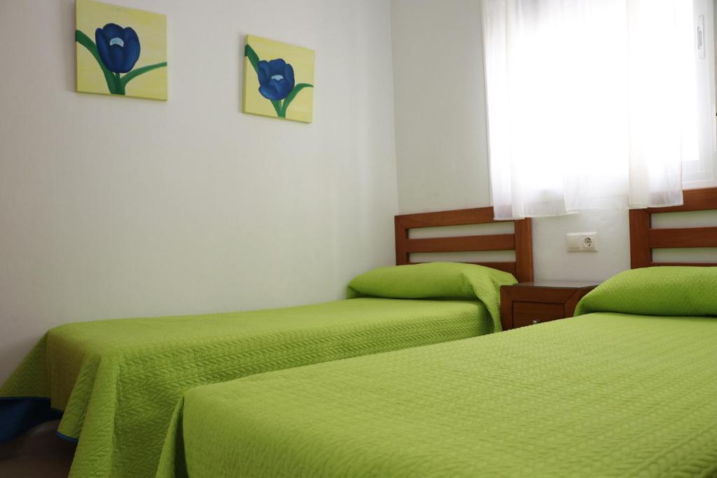 Postel nebo postele na pokoji v ubytování Apartamento central con aire acondicionado