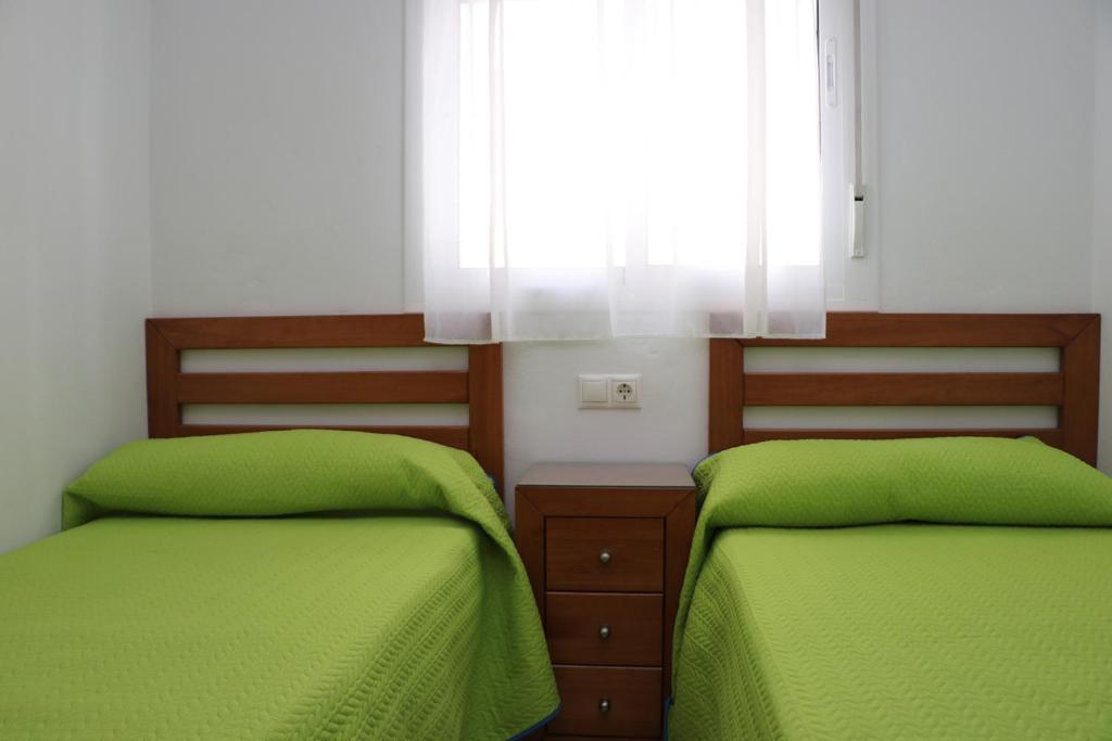 Postel nebo postele na pokoji v ubytování Apartamento central con aire acondicionado