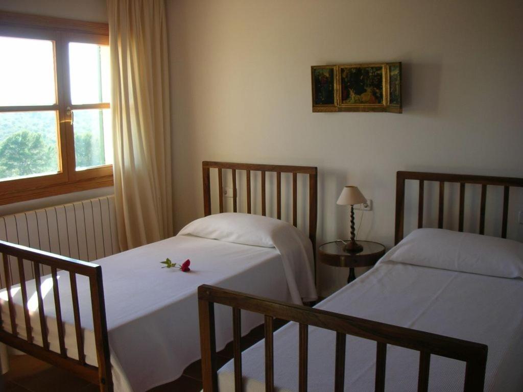 Postel nebo postele na pokoji v ubytování Sa Taulada