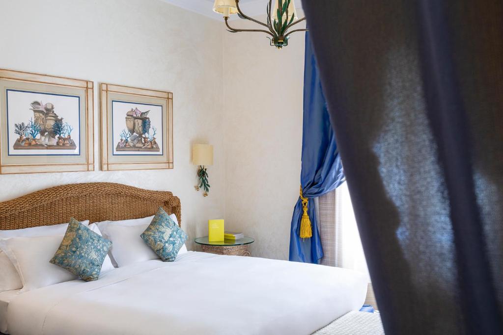 Postel nebo postele na pokoji v ubytování Manzi Hotel & Spa