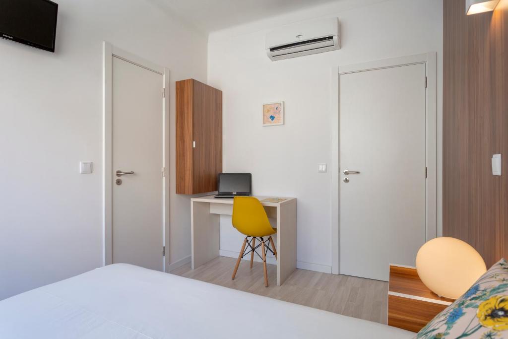 Postel nebo postele na pokoji v ubytování Next Inn