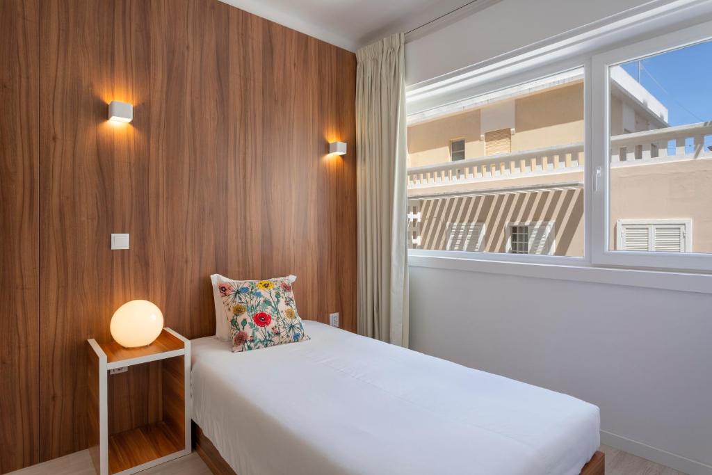 Postel nebo postele na pokoji v ubytování Next Inn