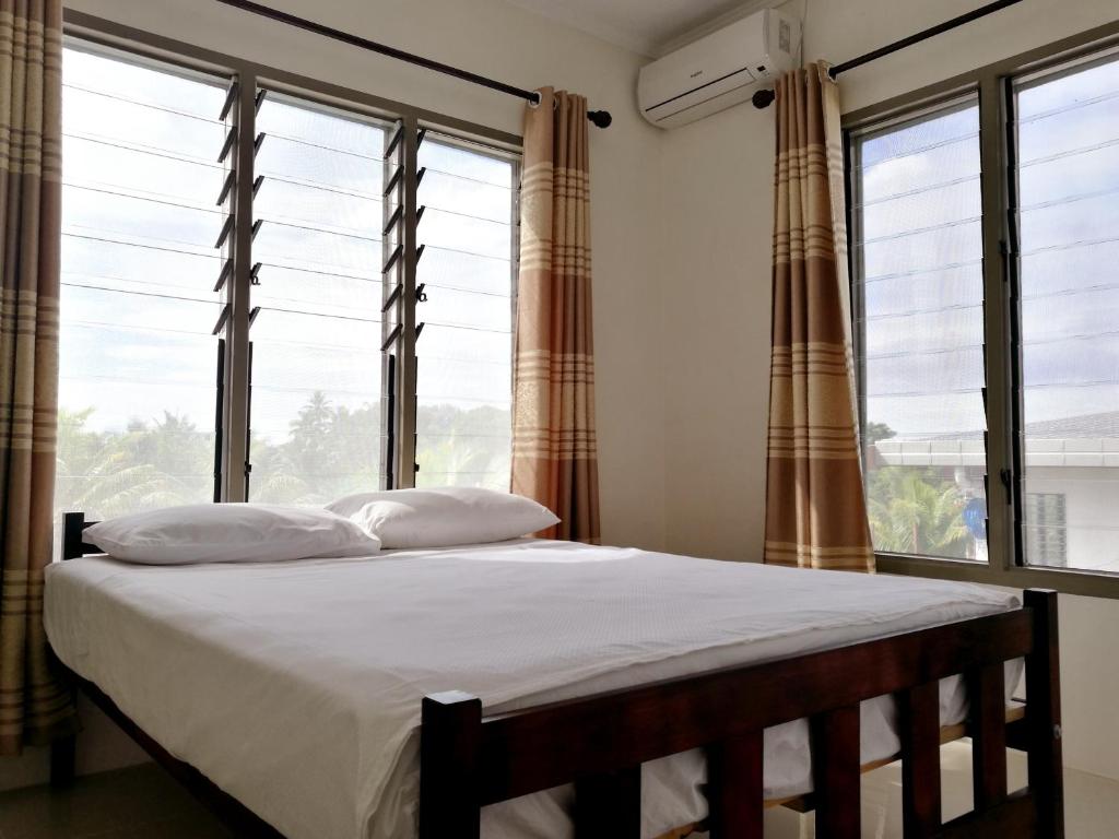 Postel nebo postele na pokoji v ubytování FIJI HOME Apartment Hotel