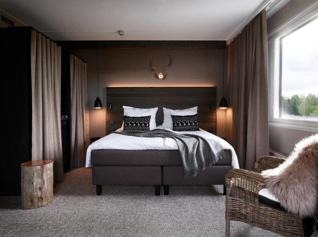 Een bed of bedden in een kamer bij Lapland Hotels Kuopio