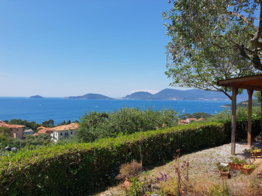 a view of the ocean from a garden at Campeggio Gianna Golfo dei Poeti in Lerici