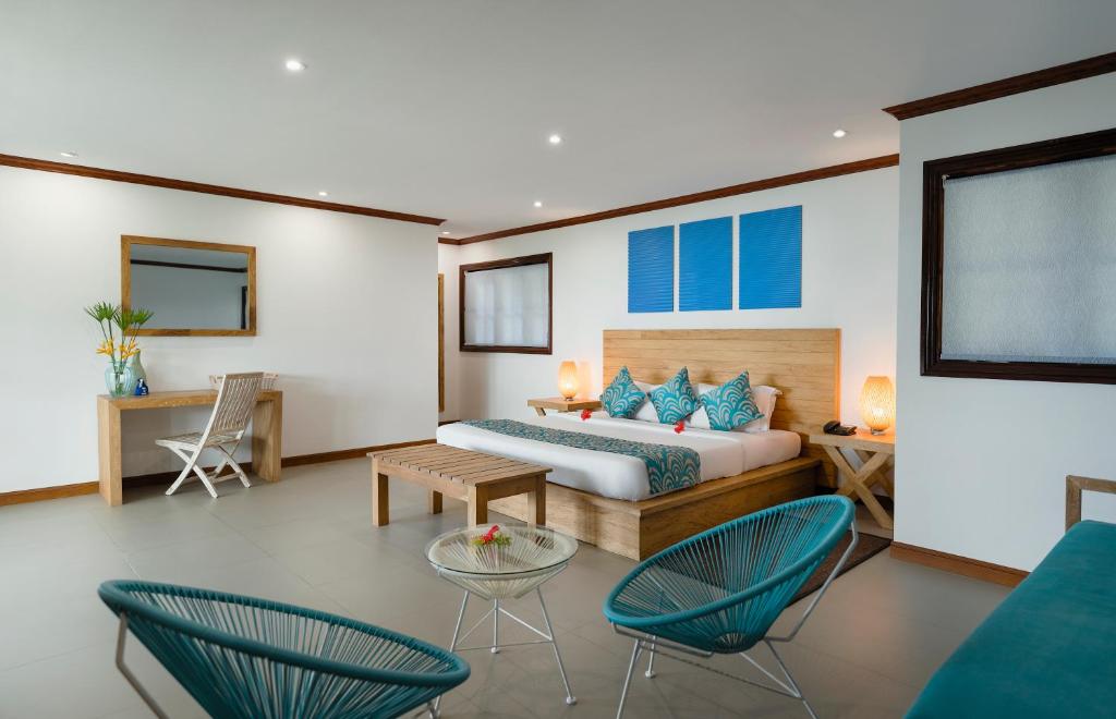 Uma cama ou camas num quarto em Hotel L'Archipel