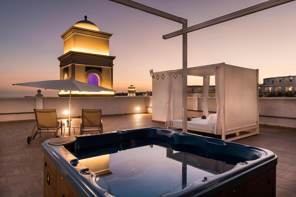 a hot tub on the roof of a building at Royal Palm Resort & Spa - Adults Only in Playa Jandia