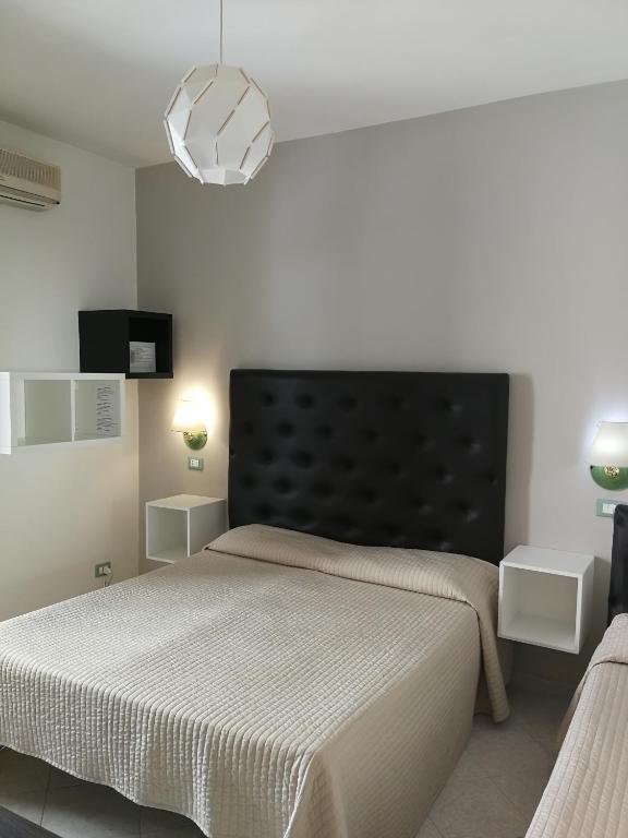Postel nebo postele na pokoji v ubytování IG-Tysandros Hotel Apartments