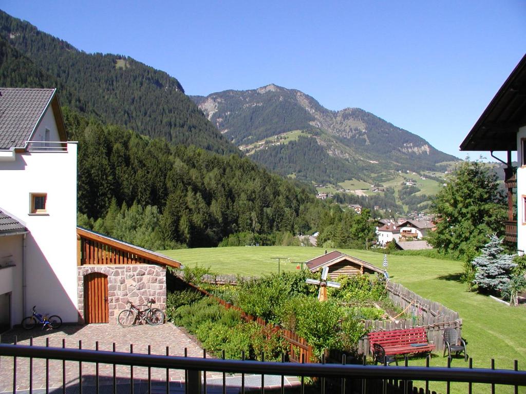 a view of a mountain range from a house at Apartments Petlin in Ortisei