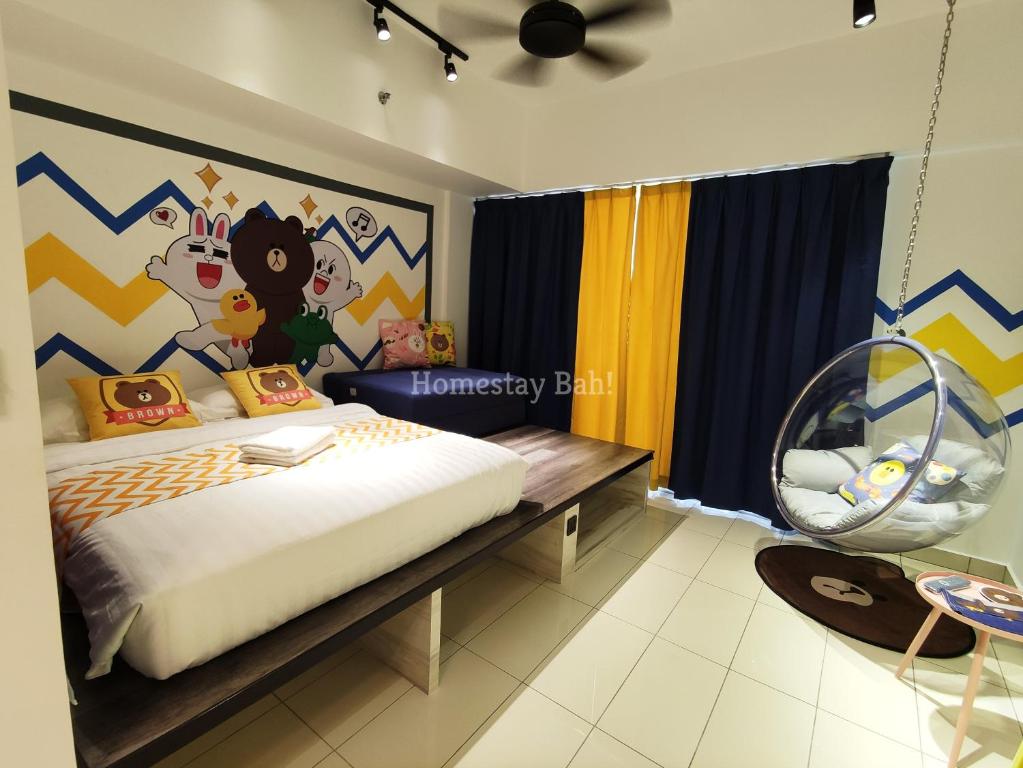 a bedroom with a bed with a mural of mickey mouse at Homestay Bah! in Kota Kinabalu