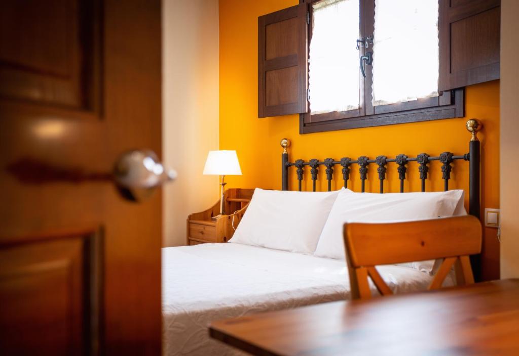 Postel nebo postele na pokoji v ubytování Apartamentos Rurales Villa del Sain Cudillero