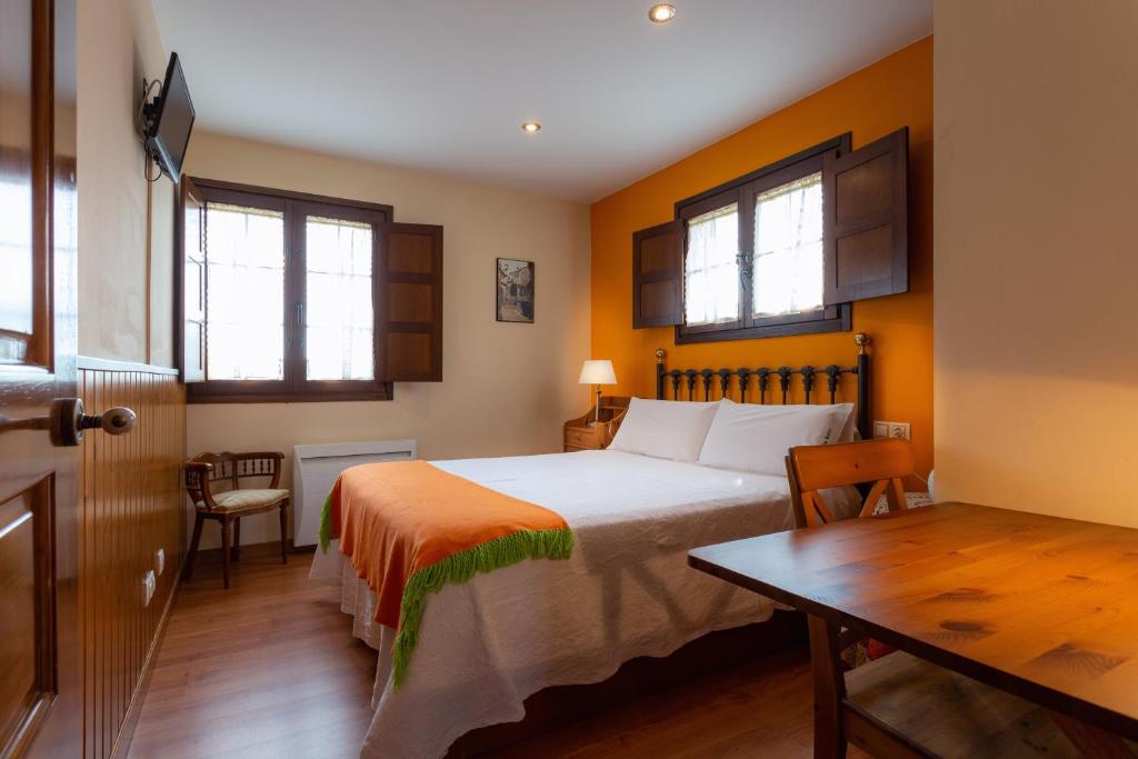 Postel nebo postele na pokoji v ubytování Apartamentos Rurales Villa del Sain Cudillero