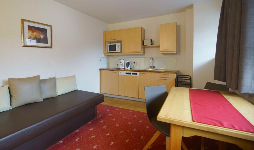 Kuchyň nebo kuchyňský kout v ubytování B&B Gästehaus Alpenblick