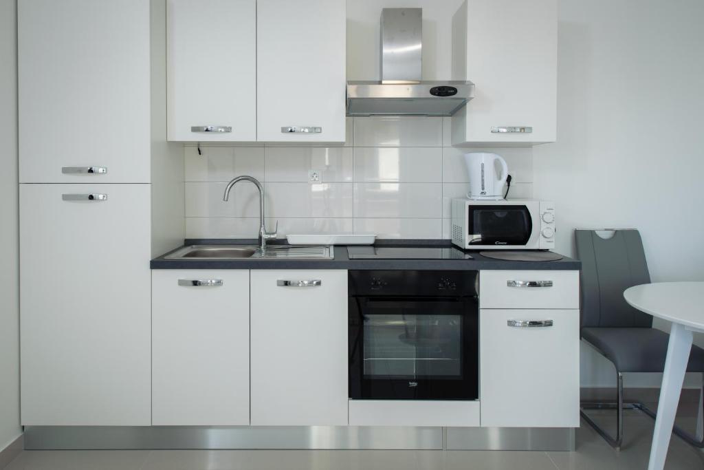 Kuchyň nebo kuchyňský kout v ubytování NERA lux apartment