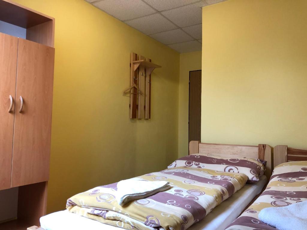 Postel nebo postele na pokoji v ubytování Penzion Samorost