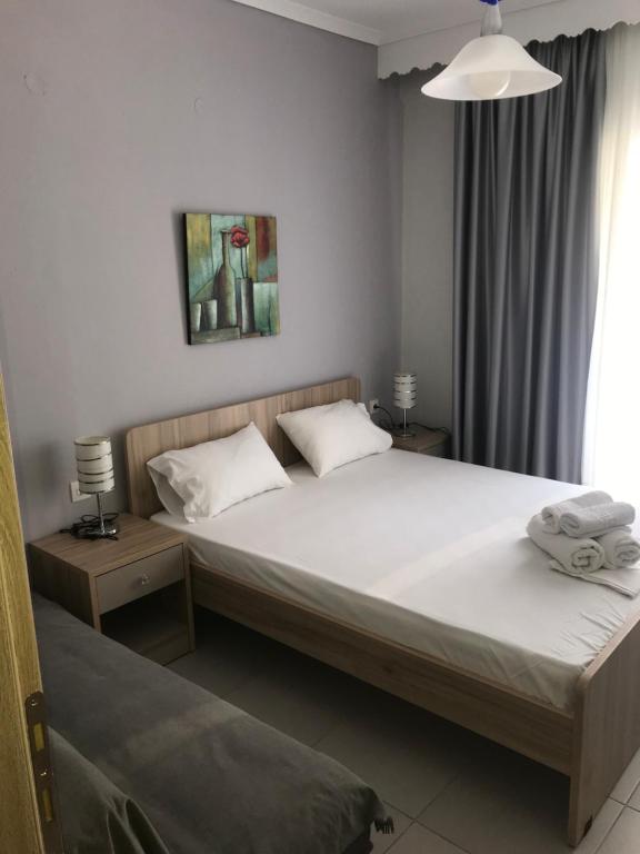 Postel nebo postele na pokoji v ubytování Theodora Villas Flogita beach