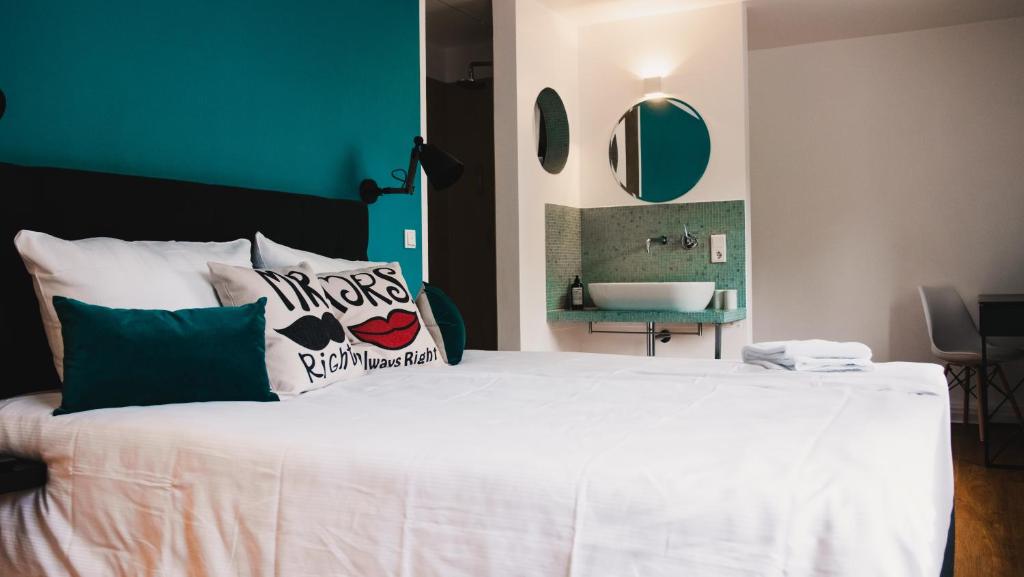 Postel nebo postele na pokoji v ubytování Hotel Palmenbad