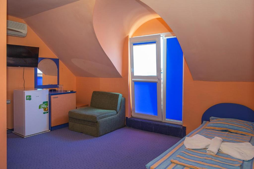 Postel nebo postele na pokoji v ubytování Dara Hotel