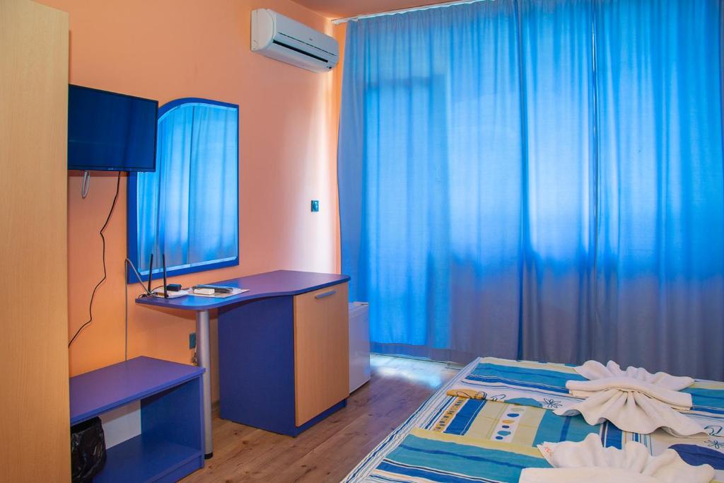 Postel nebo postele na pokoji v ubytování Dara Hotel