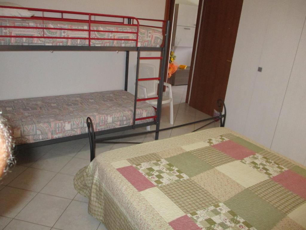 Posteľ alebo postele v izbe v ubytovaní SoleMare Sud Sardegna
