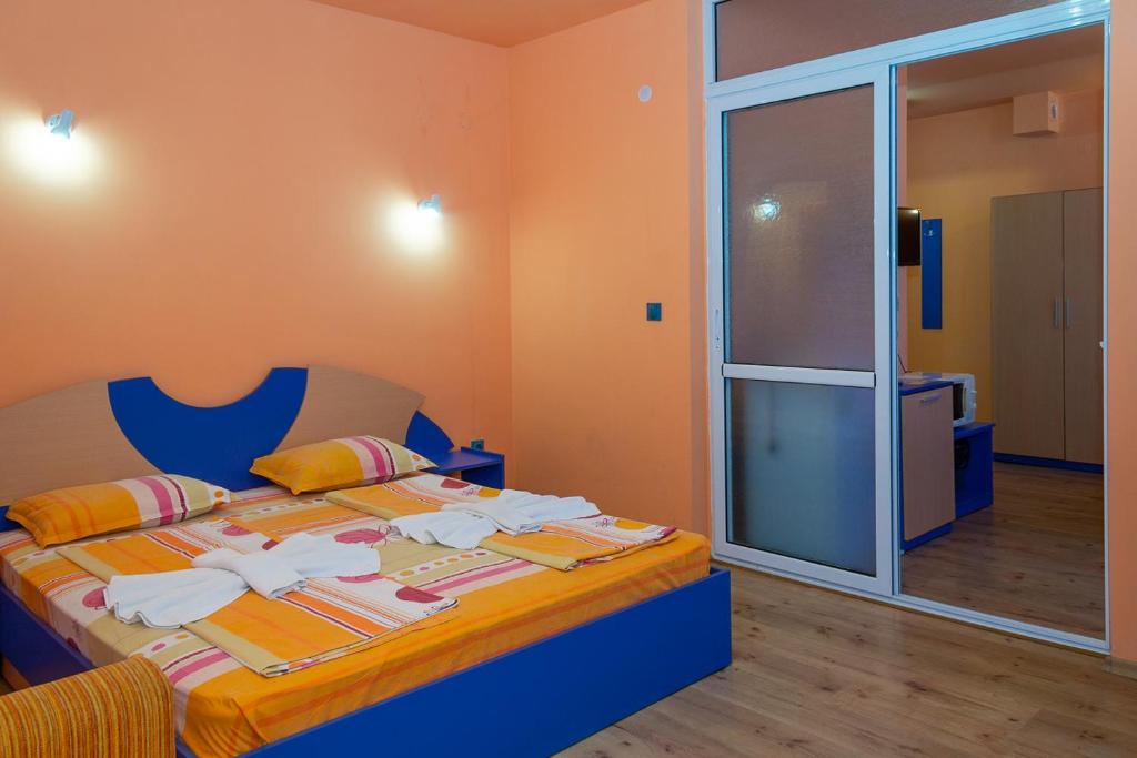 Postel nebo postele na pokoji v ubytování Dara Hotel