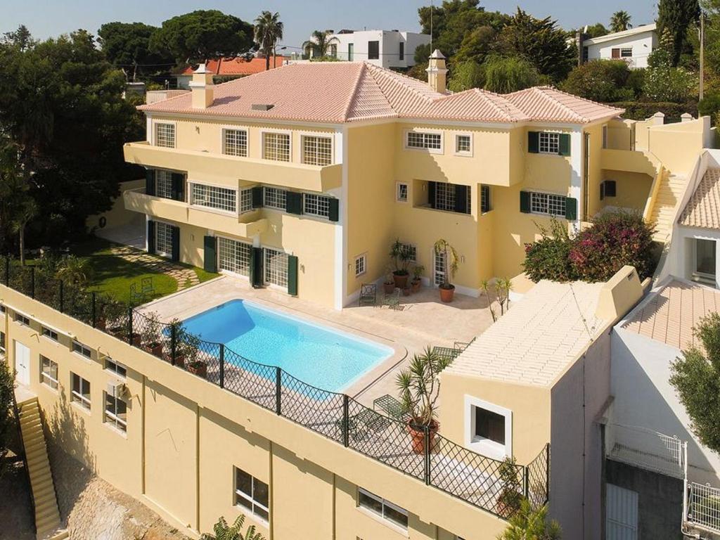 an aerial view of a house with a swimming pool at Estoril Luxury Suites & Spa - Cascais in Estoril