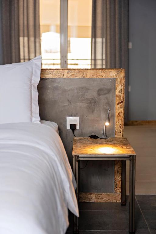 Postel nebo postele na pokoji v ubytování Piraeus Premium Suites