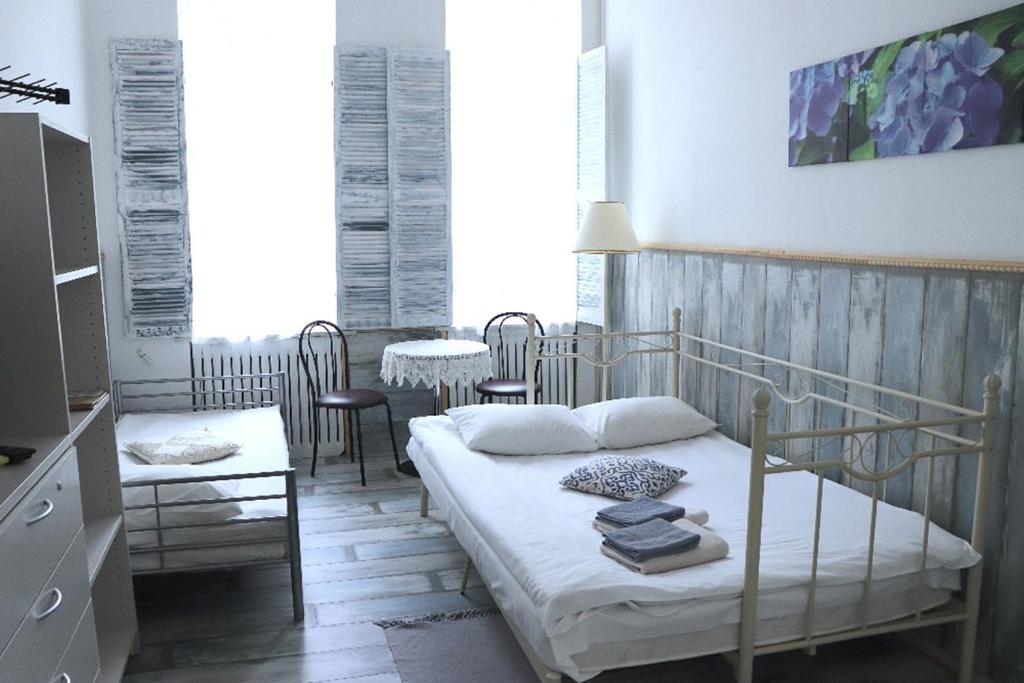 Postel nebo postele na pokoji v ubytování Maison Blanche Kyiv city center