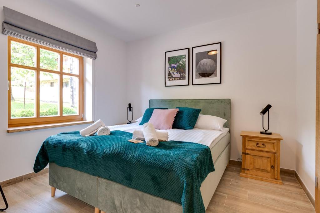 Posteľ alebo postele v izbe v ubytovaní Biała Owieczka B&B Szczyrk