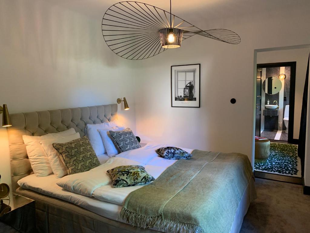 Postel nebo postele na pokoji v ubytování Hesselby Slott