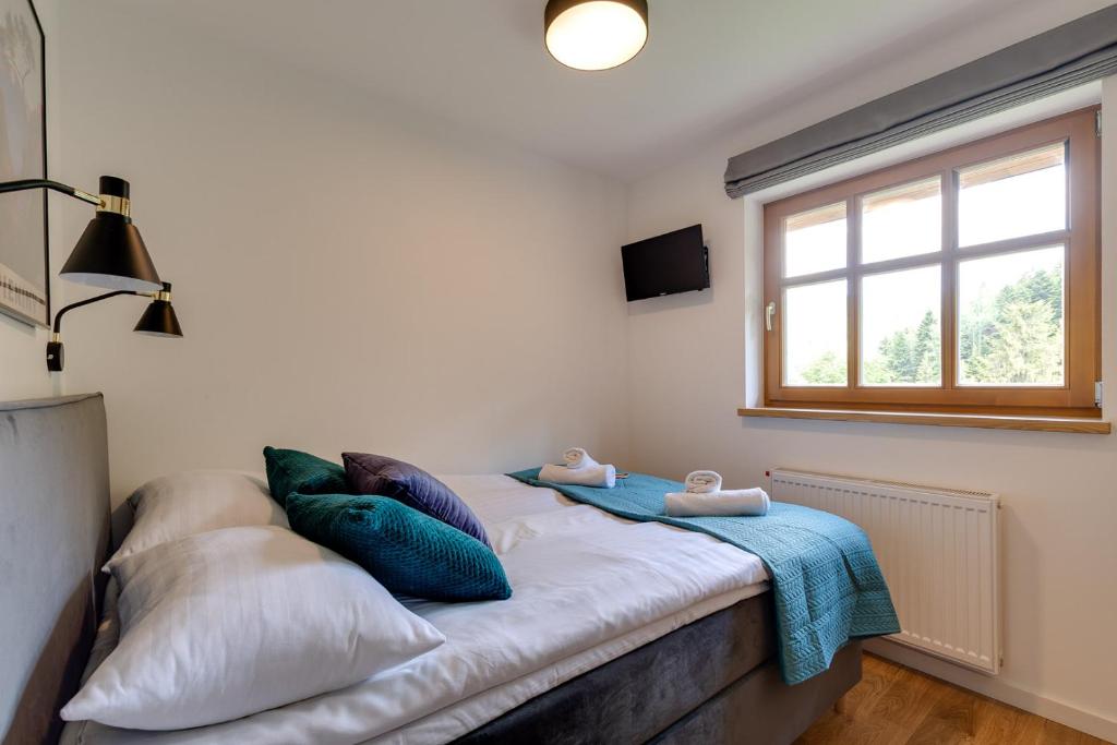 Posteľ alebo postele v izbe v ubytovaní Biała Owieczka B&B Szczyrk