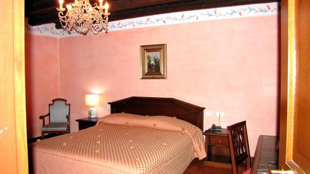 Łóżko lub łóżka w pokoju w obiekcie Agriturismo Cassinazza