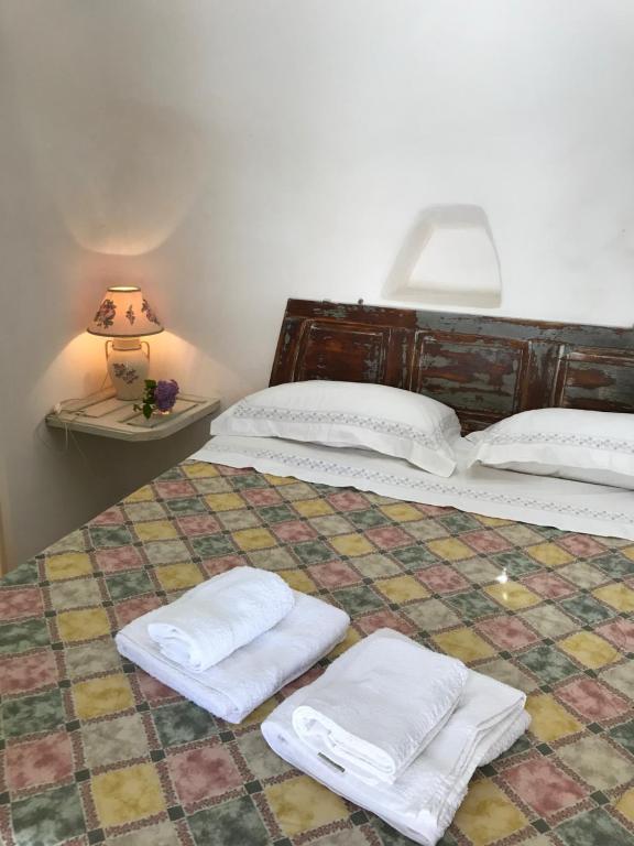 Posteľ alebo postele v izbe v ubytovaní Borgo trulli 1789