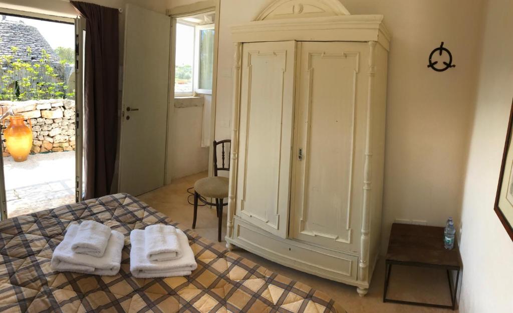 Posteľ alebo postele v izbe v ubytovaní Borgo trulli 1789
