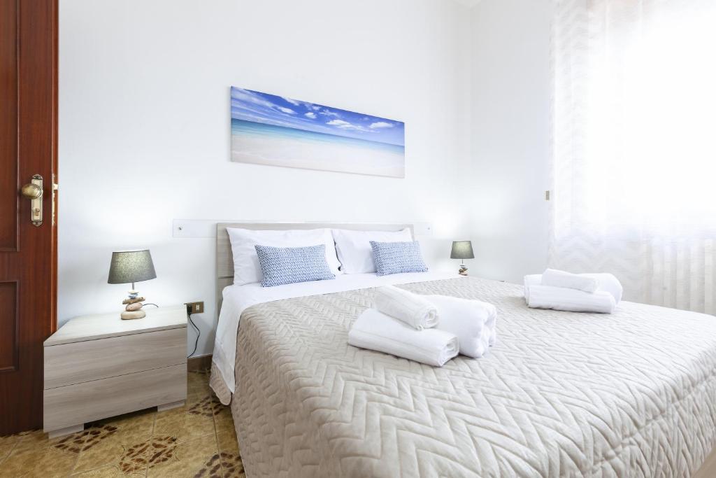 Postel nebo postele na pokoji v ubytování Lupomonaco Rooms