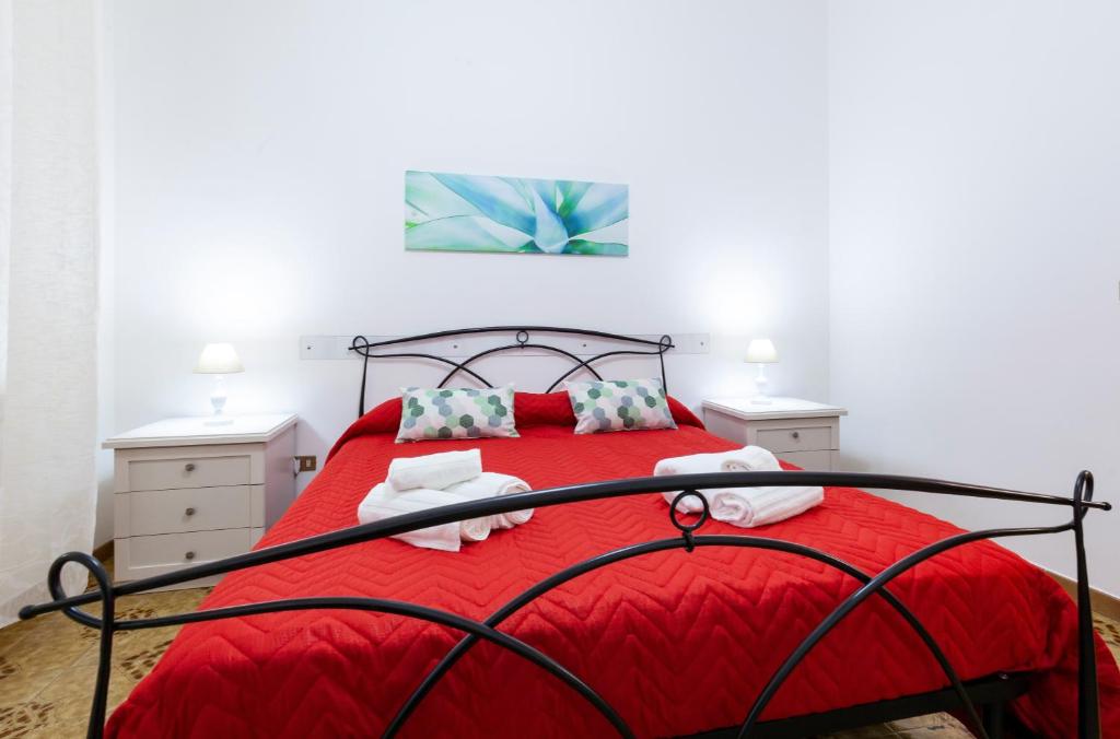 Postel nebo postele na pokoji v ubytování Lupomonaco Rooms