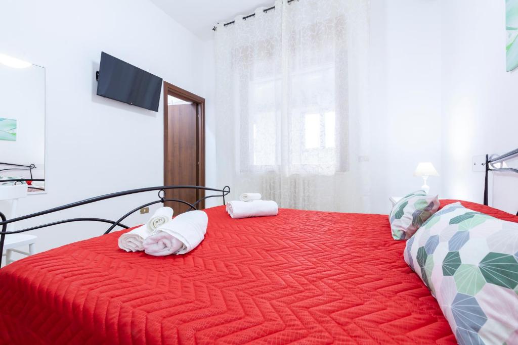 Postel nebo postele na pokoji v ubytování Lupomonaco Rooms